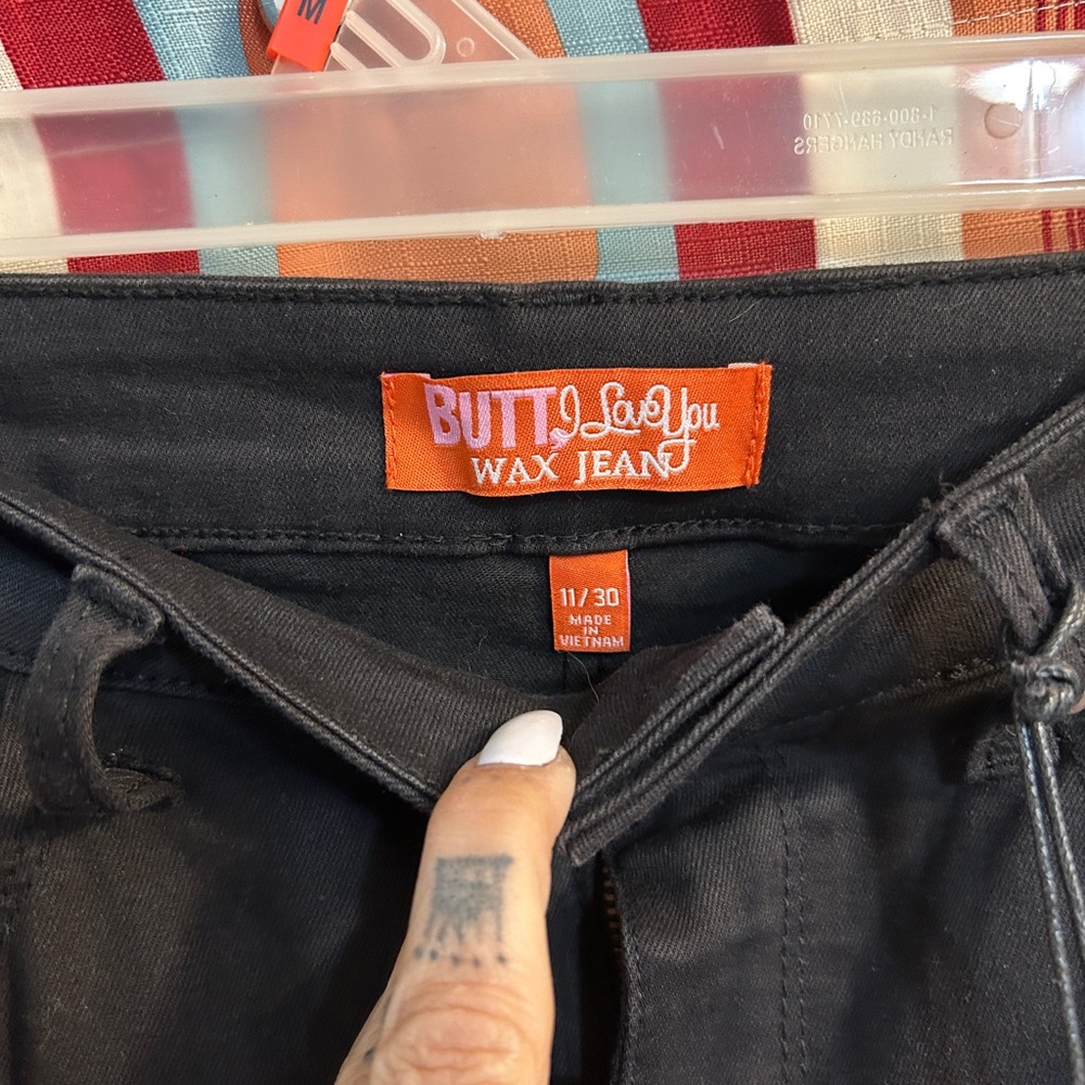 Wax Jean Black Pants with Pink Brand Tag